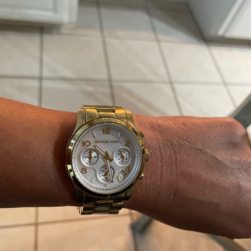 Michael Kors Womens gold tone watch 6 inch wrist band …good condition